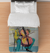 Tempo Tapestry Comforter on a neatly made bed in a chic bedroom.